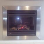 Custom stainless steel fireplace suround